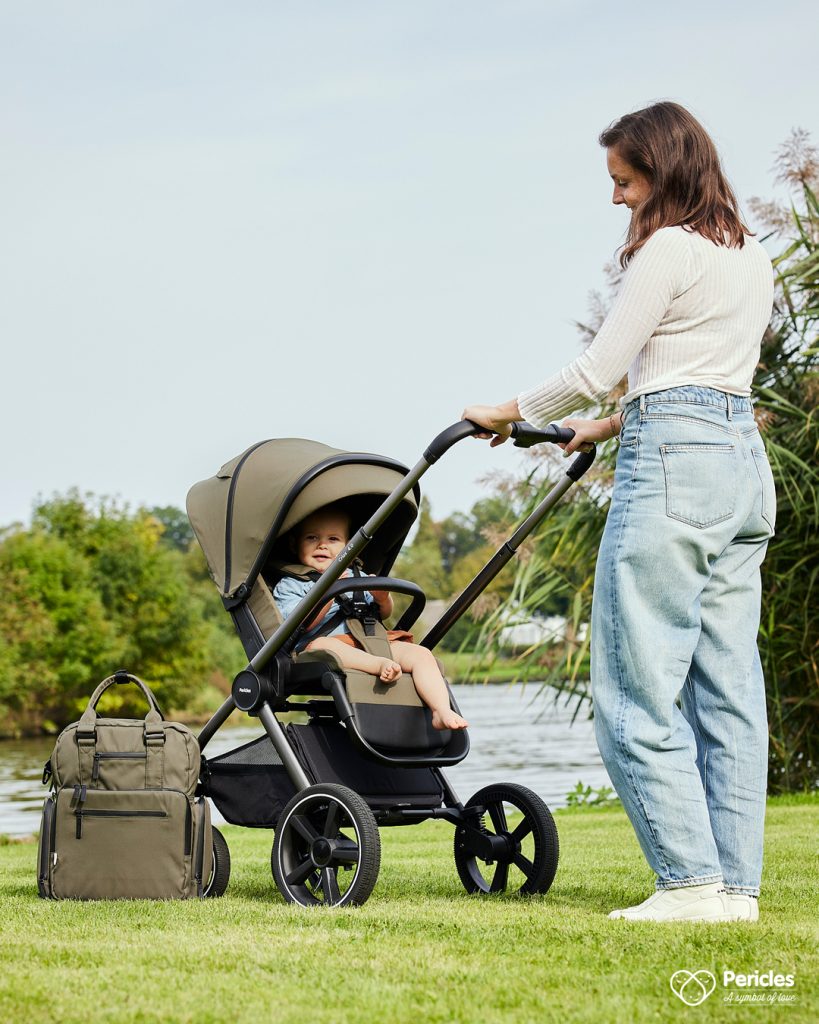Professional outdoor photo of mother and child in stroller